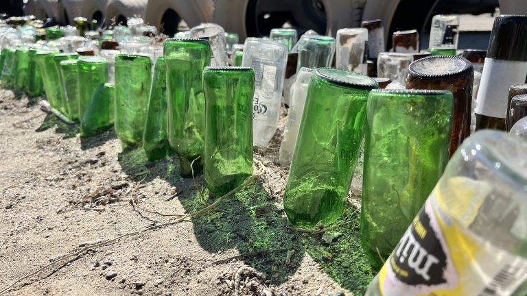 Old glass bottles buried in the dirt