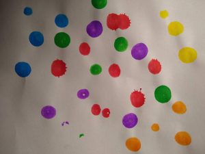 Colourful dots on paper