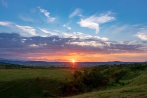 Sunset over a field in Romania