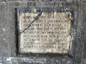 Sign on the wall in the Cathedral of Barcelona