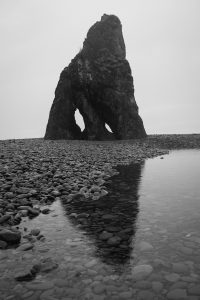 Reflection of a boulder on the Washington coastline
