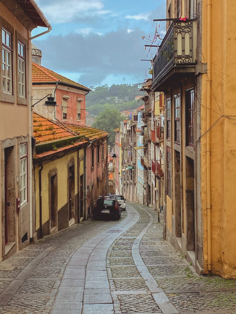 Porto, Portugal. Old town street with beautiful buildings and stone road.