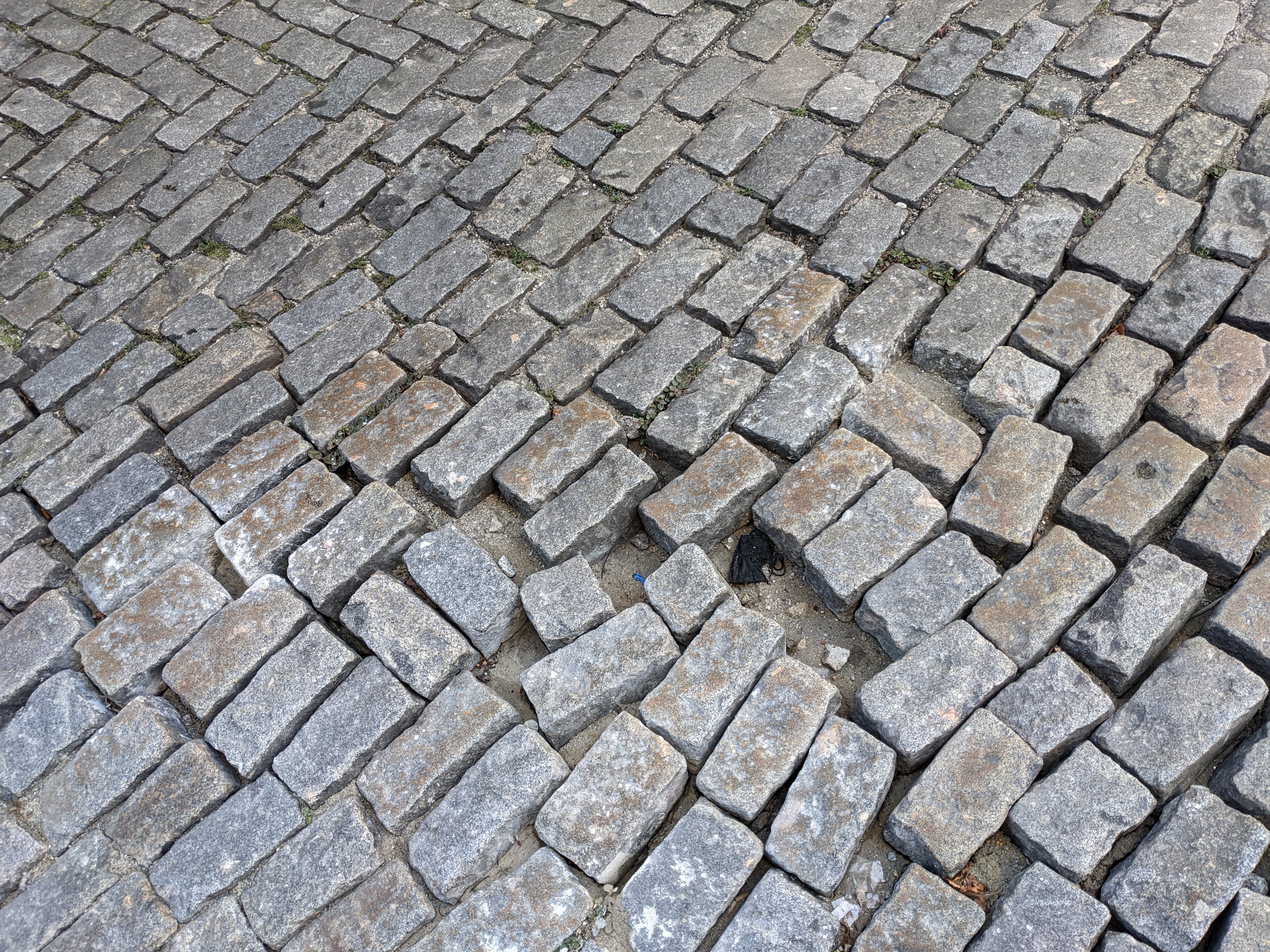 Cobblestone street with some gaps, a layout in need of some work.