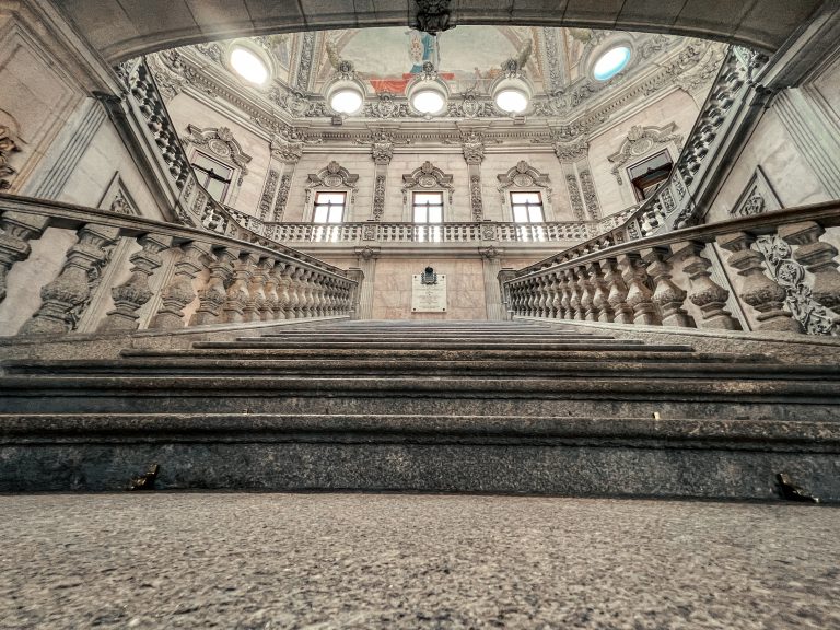 Low-angle view of the main staircase in the Palácio da Bolsa in Porto, Portugal