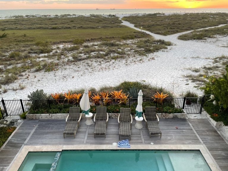 Sunset Overlooking a Pool and Beach