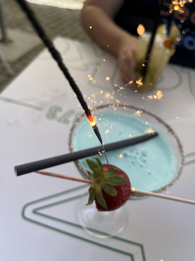 Sparkler in a Blue Hawaiian beverage