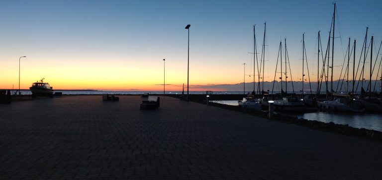 Sailing boats at the port with sunset