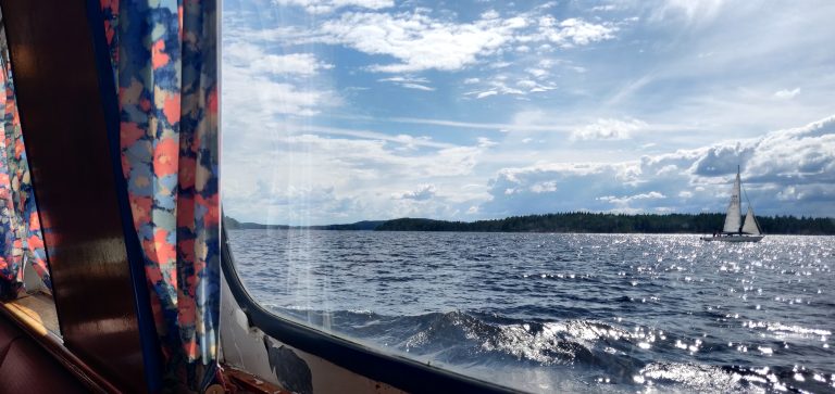 Sailing boat in Lake P?ij?nne framed in ships window