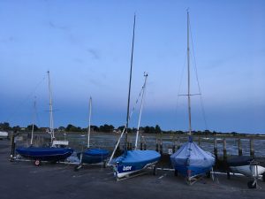 Sailing boats “resting” on dry land after a day in the water.
