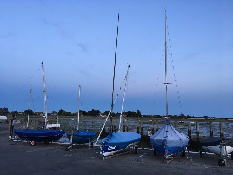 Sailing boats “resting” on dry land after a day in the water.