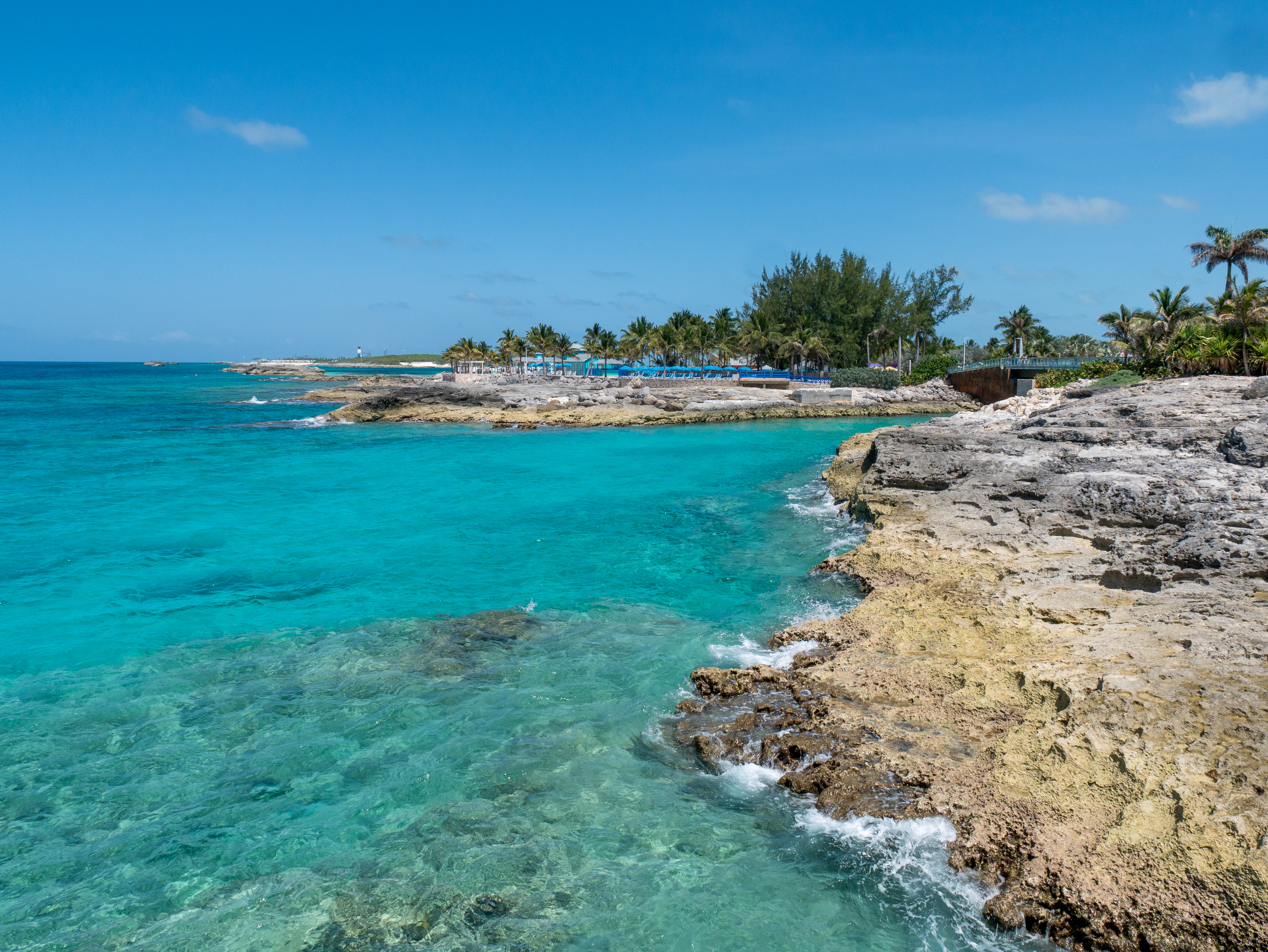 Rocky shore along clear blue tropical waters