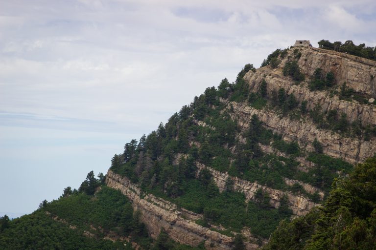 a stone house sits at the top of Sandia Peak