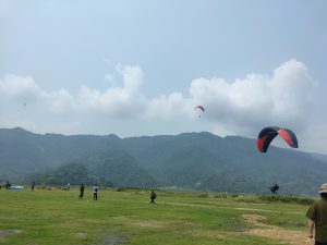 A green meadow where you will see all the parachutes land in season in Pokhara, Nepal.
