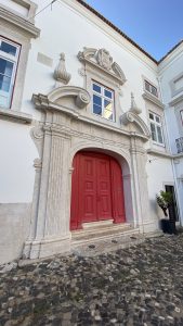 Lisbon courtyard with red door
