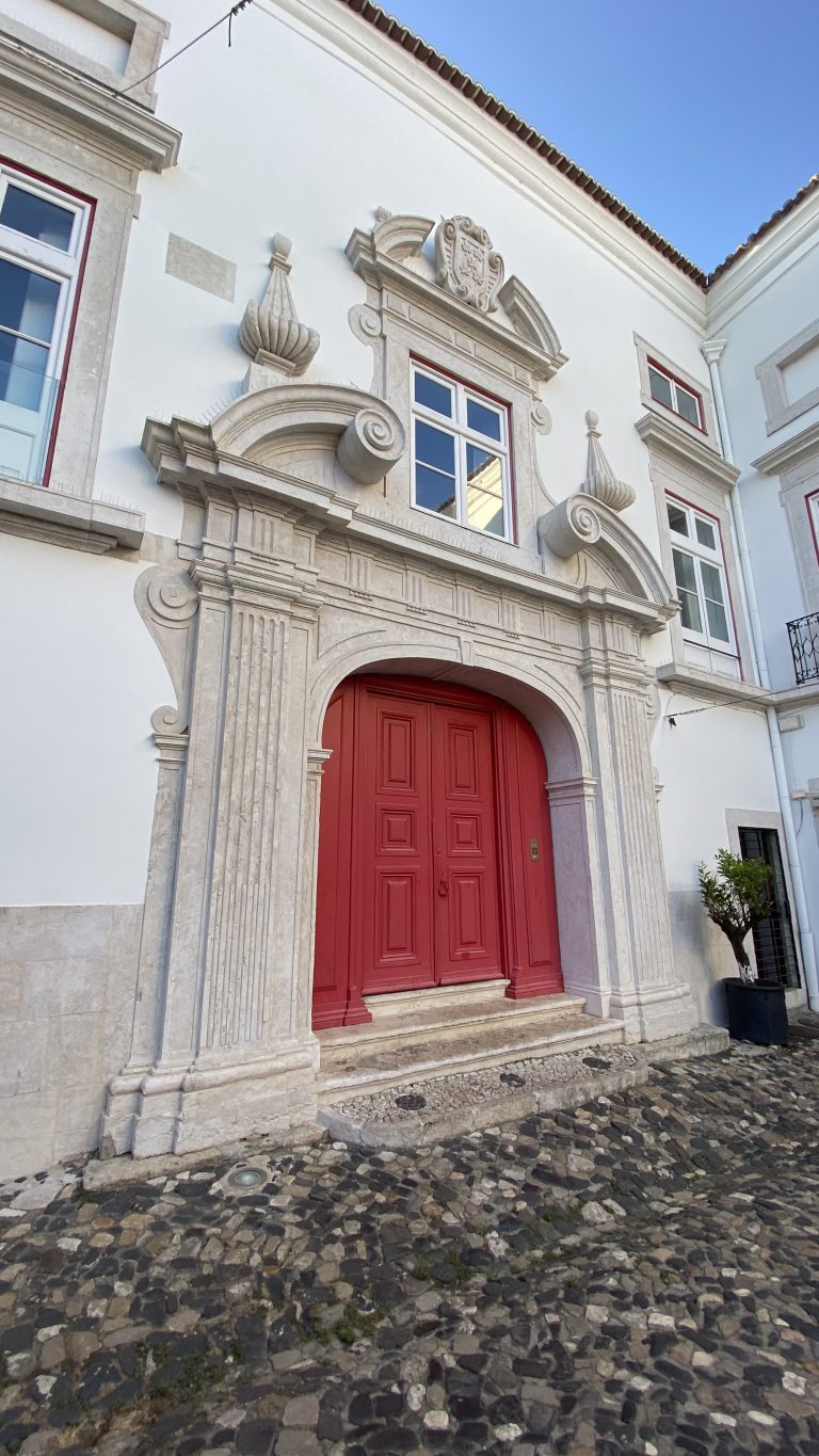 Lisbon courtyard with red door