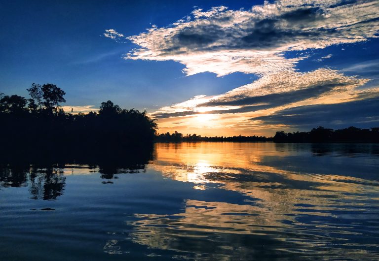 A great picture of sunset where clouds reflect on the water.