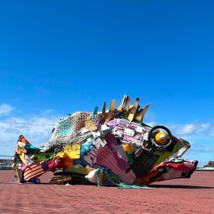 Sculpture of a Mero ( Grouper ) on the waterfront in Funchal Madeira. Made from recycled plastic. Deep blue sky.
