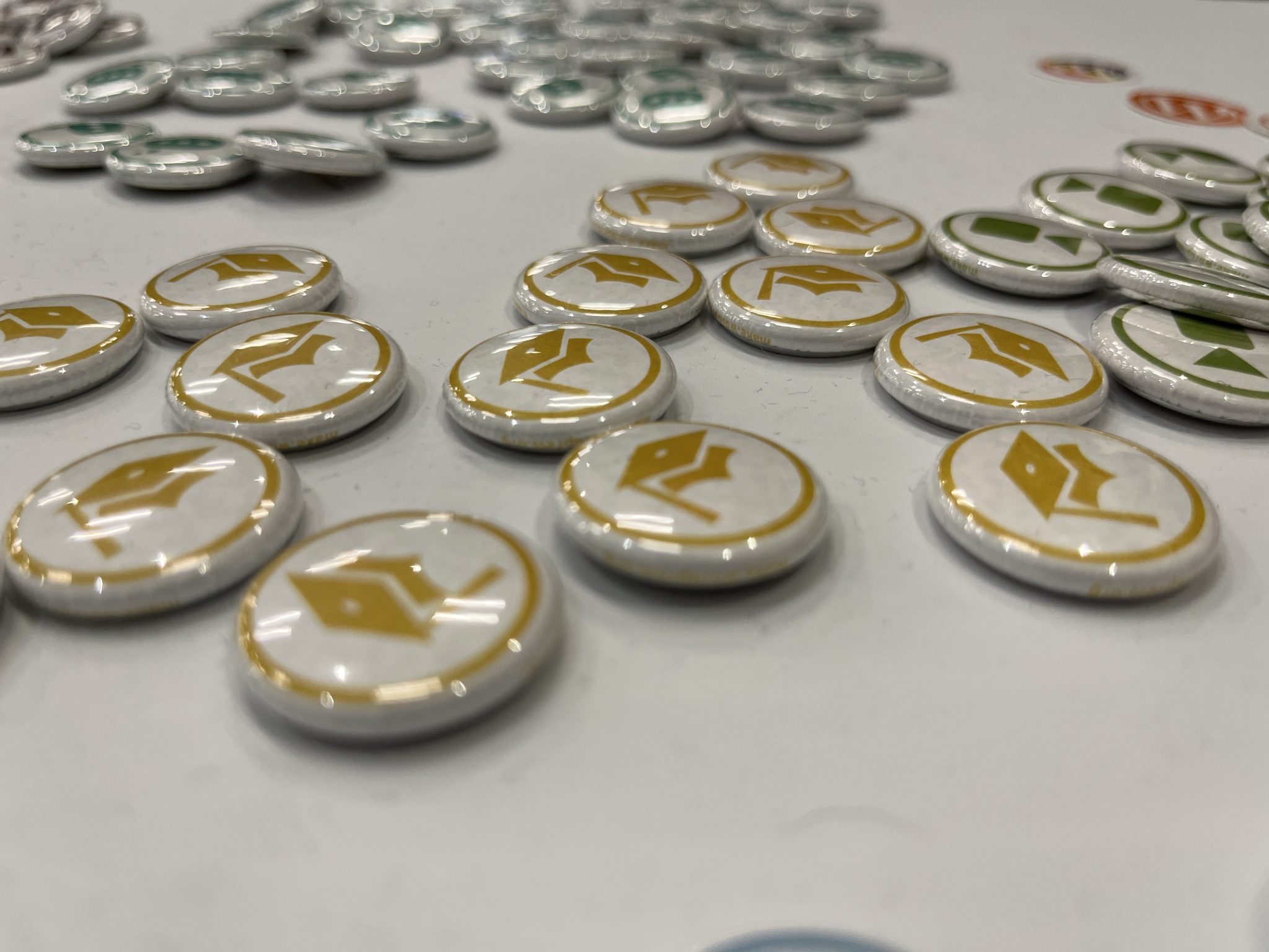 Buttons with yellow graduation caps on them representing the WordPress Training Team