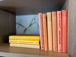 Orange books on a book shelf