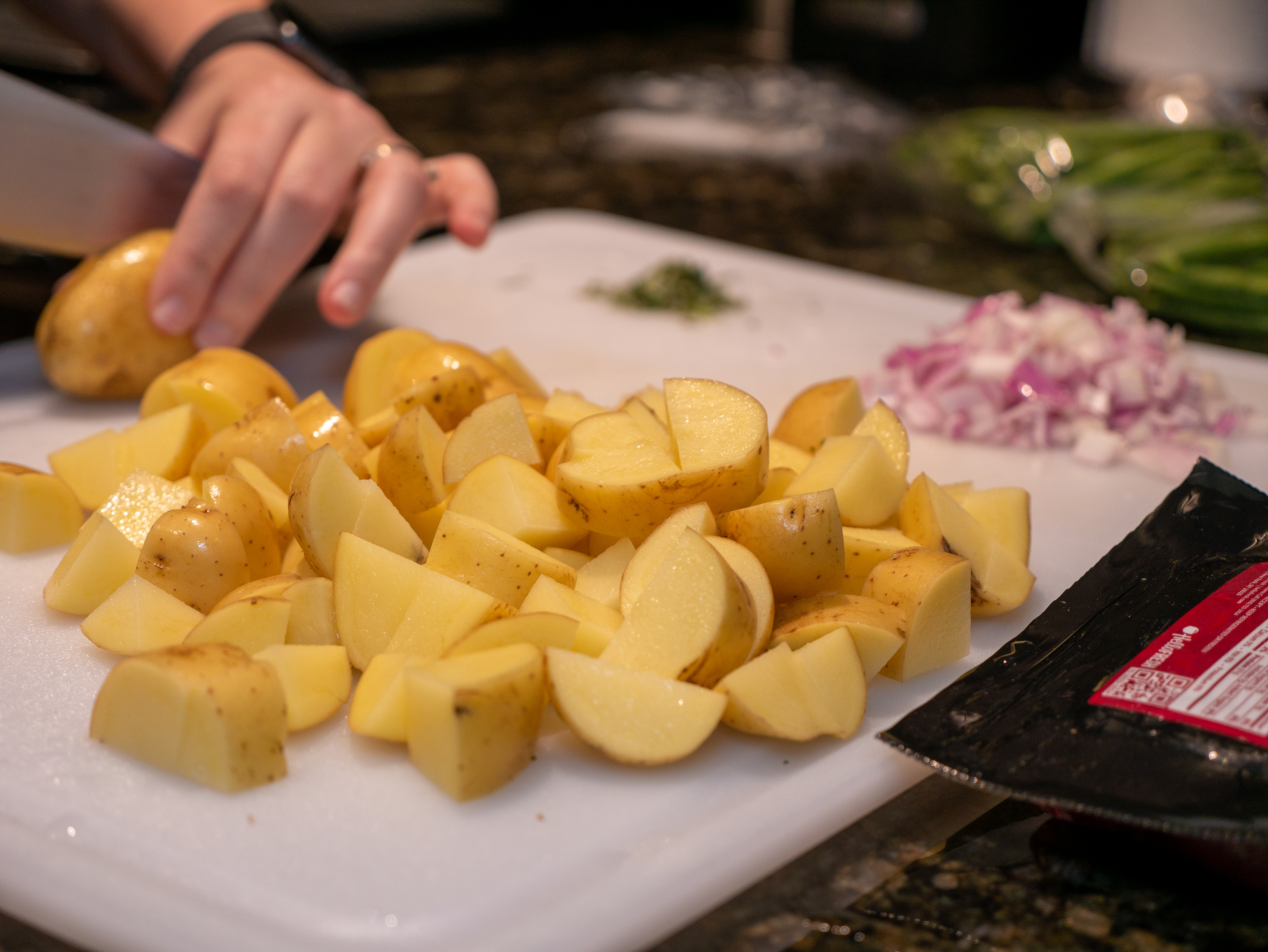 Potatoes being chopped in the kitchen