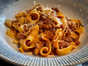 Pasta in a meat sauce at an Italian restaurant