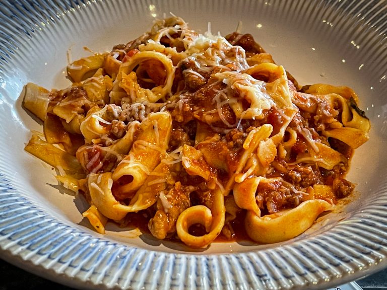 Pasta in a meat sauce at an Italian restaurant