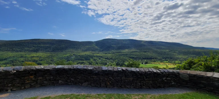 Vermont Green Mountains with Stone wall and gravel path at Hildene in Manchester VT