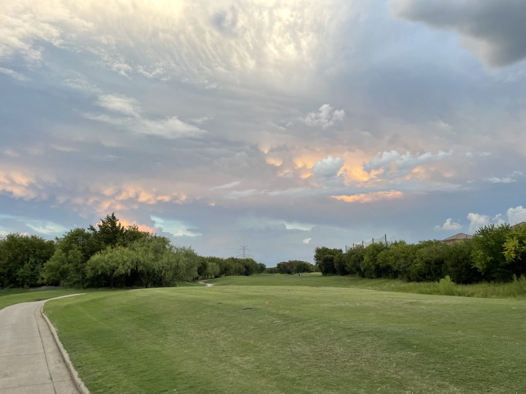 colorful evening sky over a golf course