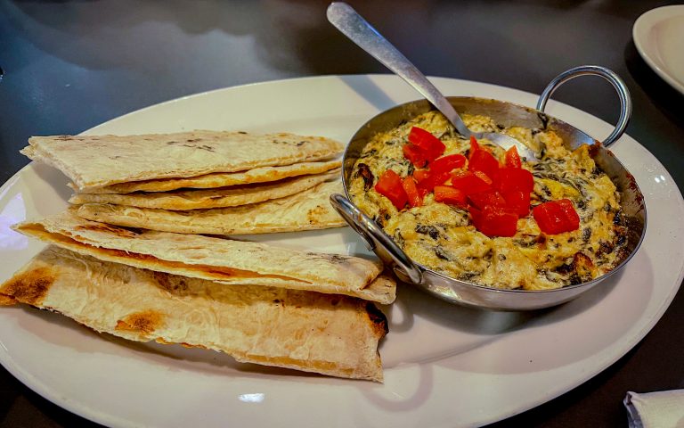 Spinach artichoke dip appetizer with pita chips