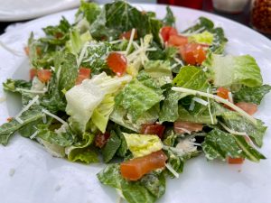 Caesar salad with tomatoes and cheese