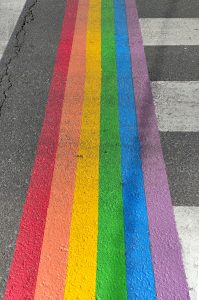 Pedestrian crossing decorated in the colours of the LGTBI flag