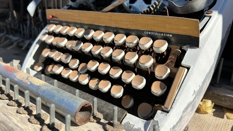 Old Discarded Typewriter With A Painted Keyboard