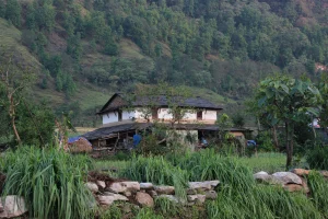 Traditional Gurung house in the lap of high hill.