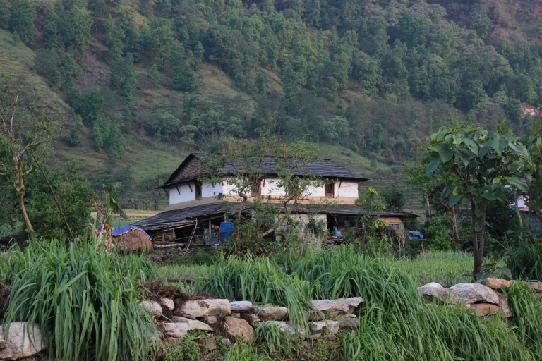 Traditional Gurung house in the lap of high hill.