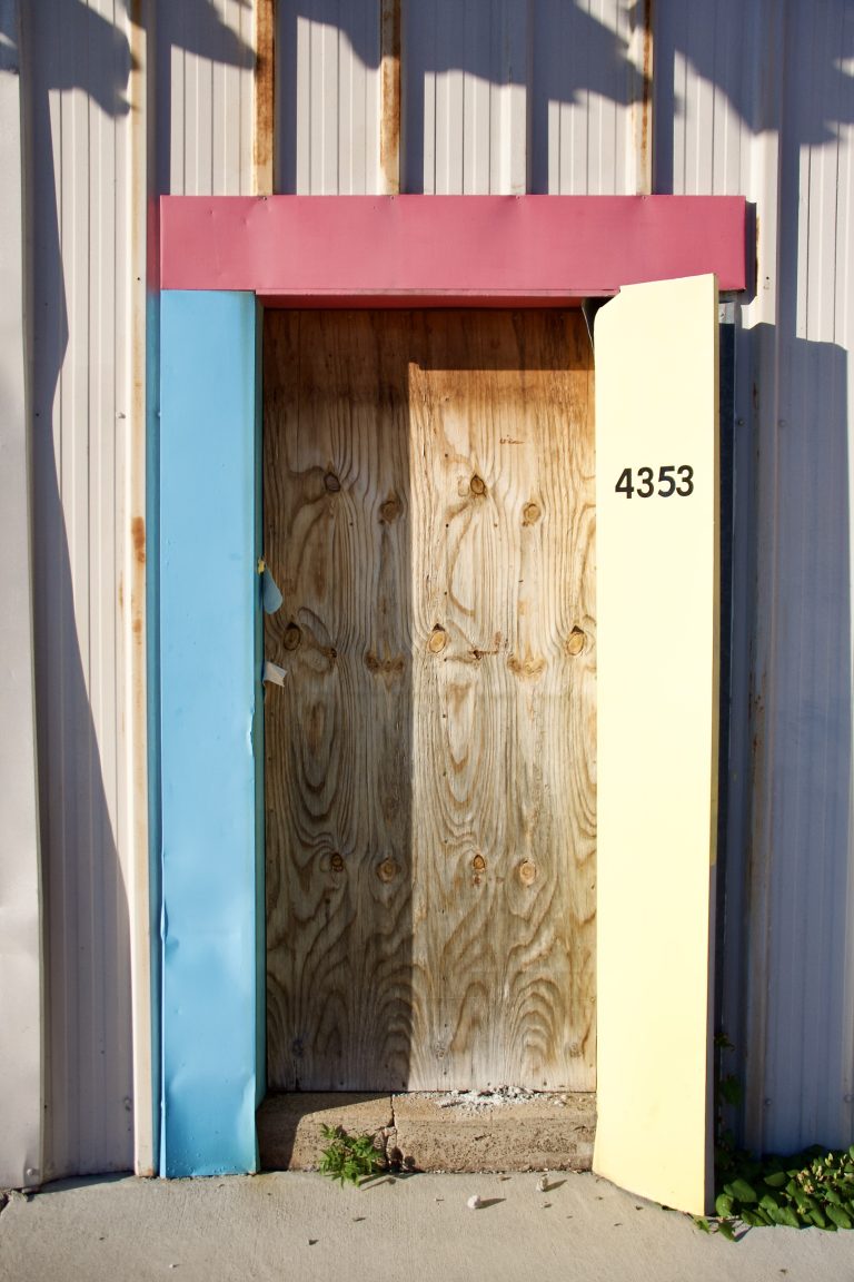 Colorful boarded up doorway in St. Louis’ Central West End