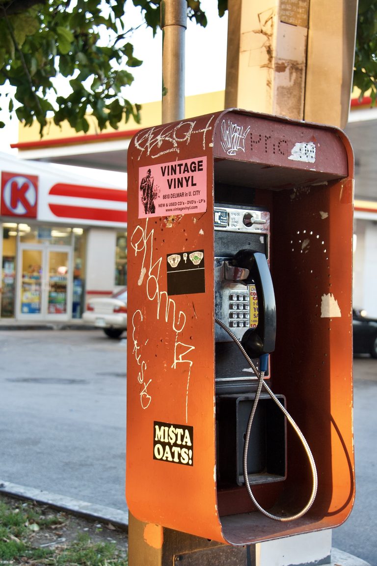 A phone booth covered with stickers on The Loop in St. Louis