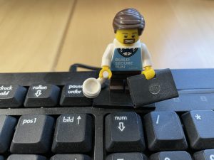 LEGO figure on keyboard.

