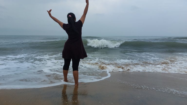 Girl dancing in a beach