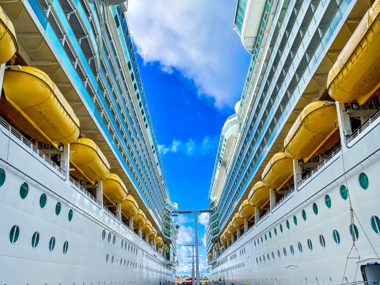 Two cruise ships docked next to each other in the Bahamas.