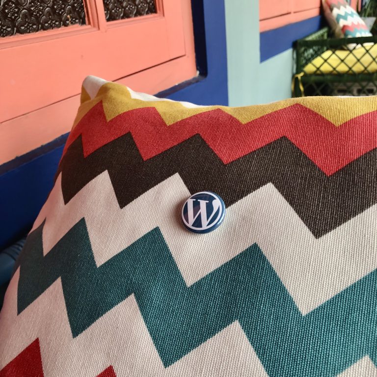 WordPress button on a colorful pillow