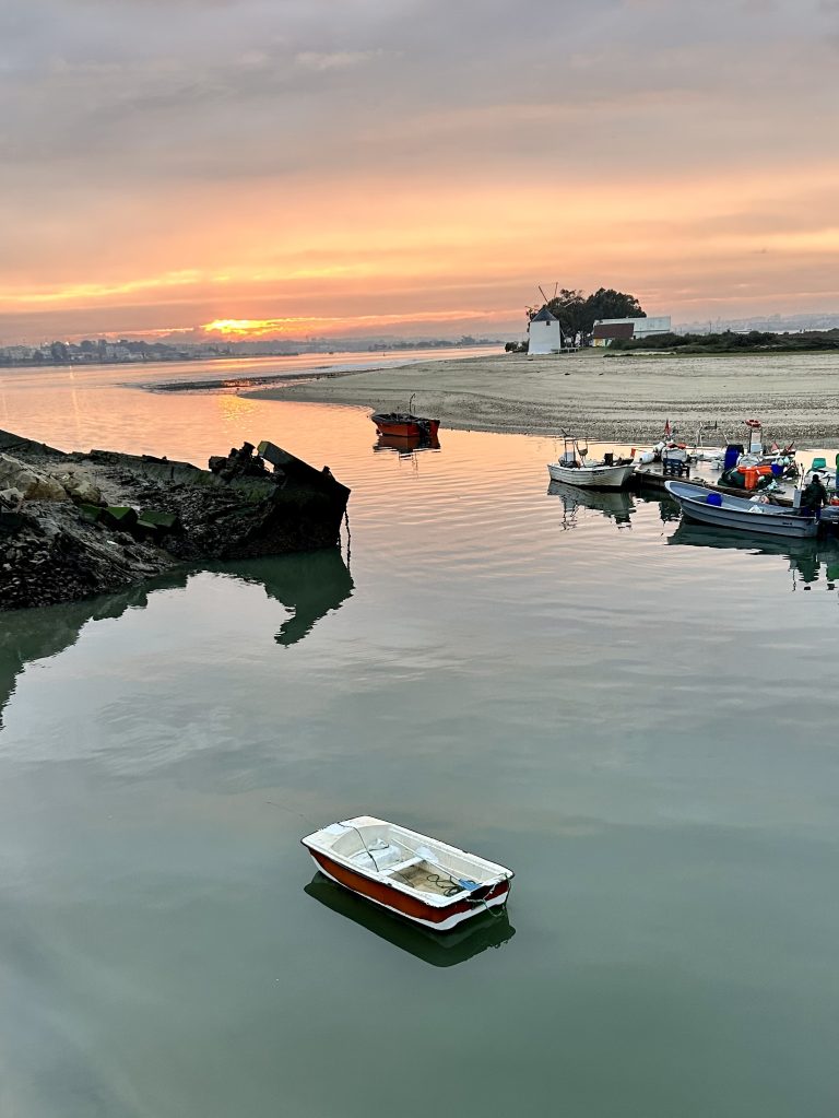 Sunset with boat, from Barreiro (Portugal) overlooking Seixal