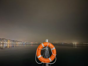 A lifebuoy with a city view. Port of Thessaloniki, Greece.