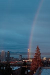 Moody rainbow next to Seattle’s space needle
