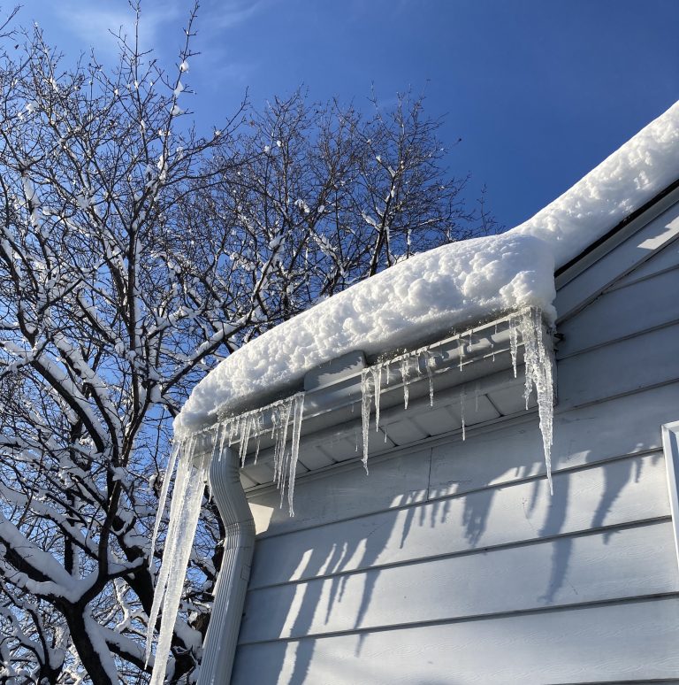 A random view snow thickness on roof and icicles formation