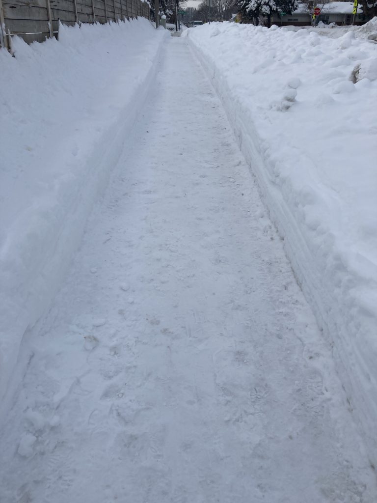 Snow cleared sidewalk for pedestrian