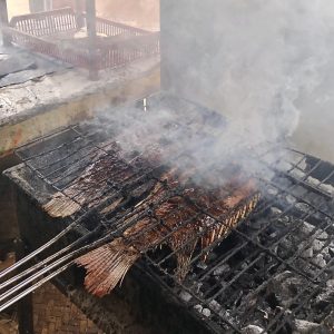 View larger photo: Grilling fish in traditional way