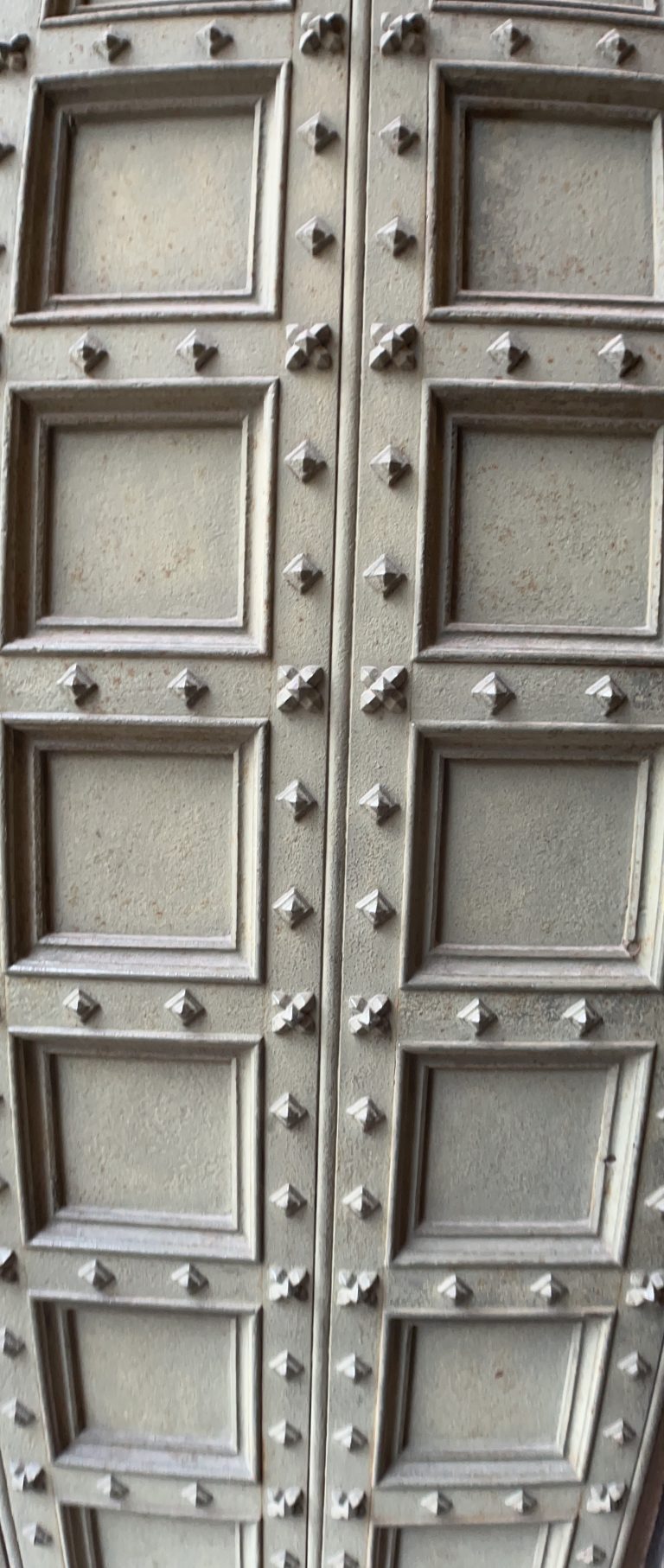 Ancient cathedral door, Duomo de Milano, Milan, Italy