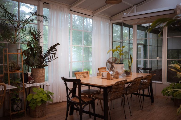 Cozy dinner table with white curtain in a comfy room