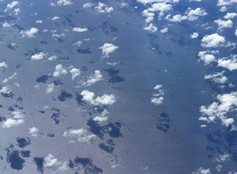 Clouds and their shadows on the sea