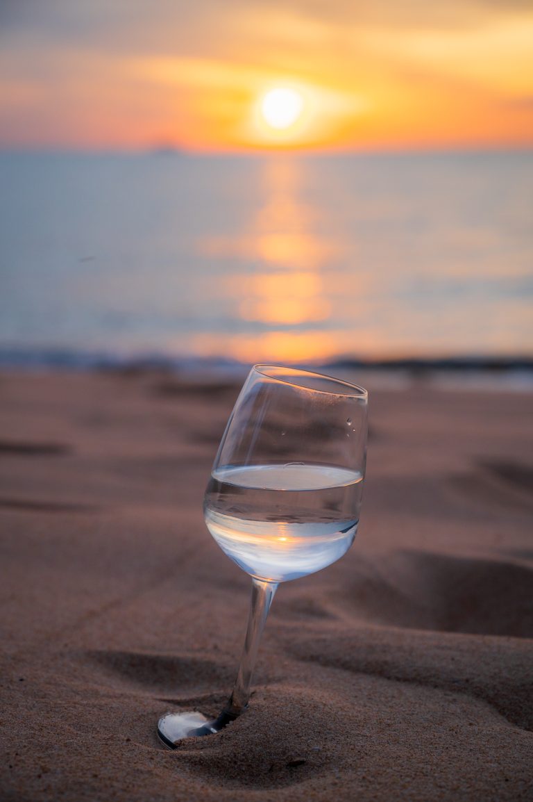 Glass on the beach at sunset